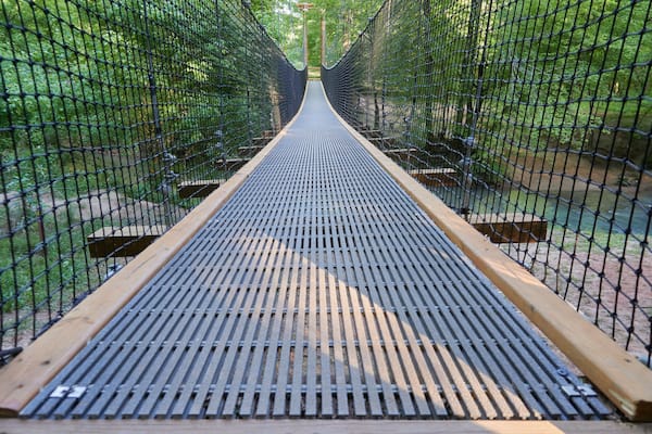 FORT MILL, SOUTH CAROLINA/UNITED STATES – APRIL 27, 2019: Suspension bridge at Anne Springs Close Greenway in Fort Mill, South Carolina.