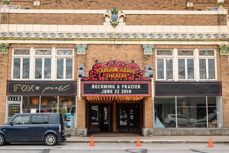 A theater marquee with "Fountain Square Theatre" and "Becoming a Frazier June 22, 2019" displayed.
