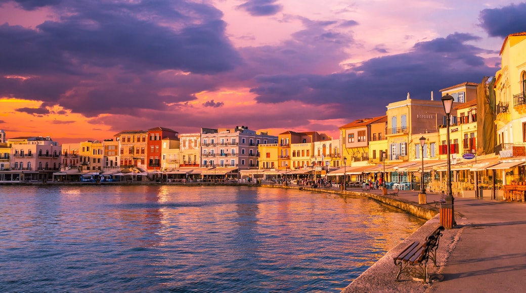 CHANIA, CRETE ISLAND, GREECE - JUNE 26, 2016: Stunning sunset view of the old venetian port of Chania on Crete island, Greece.