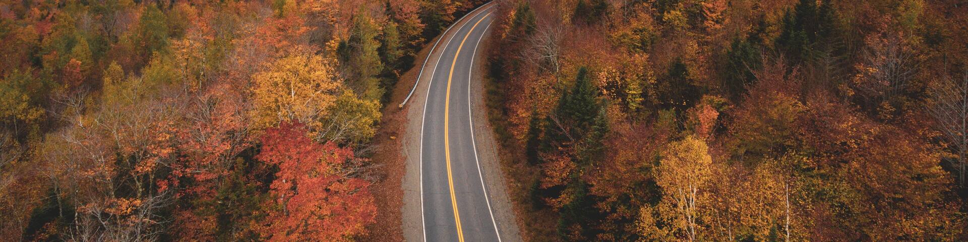 Road in the mountains with autumn color, in Abbot, Maine