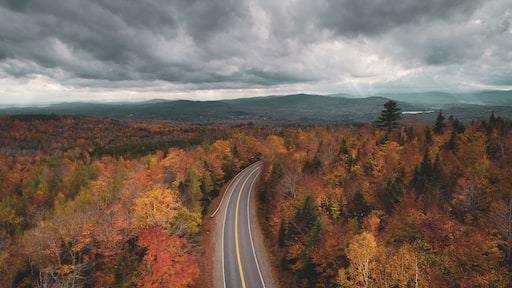 Road in the mountains with autumn color, in Abbot, Maine