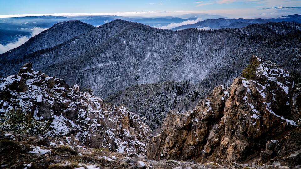 Misty white clouds forming on top of a rocky mountain / yenice forest in karabuk turkey