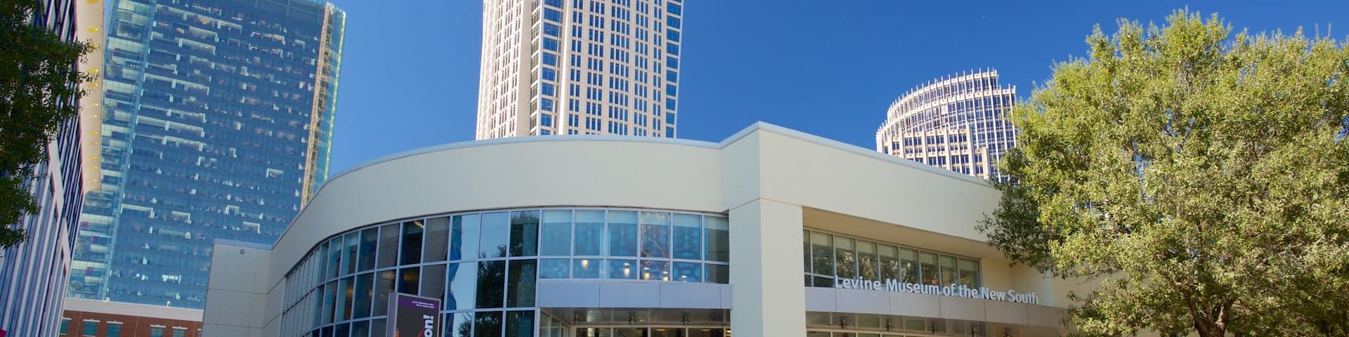 Levine Museum of the New South which includes a skyscraper and a city