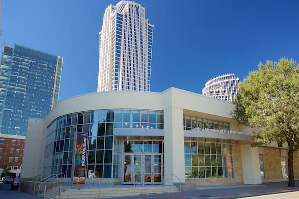 Levine Museum of the New South which includes a skyscraper and a city