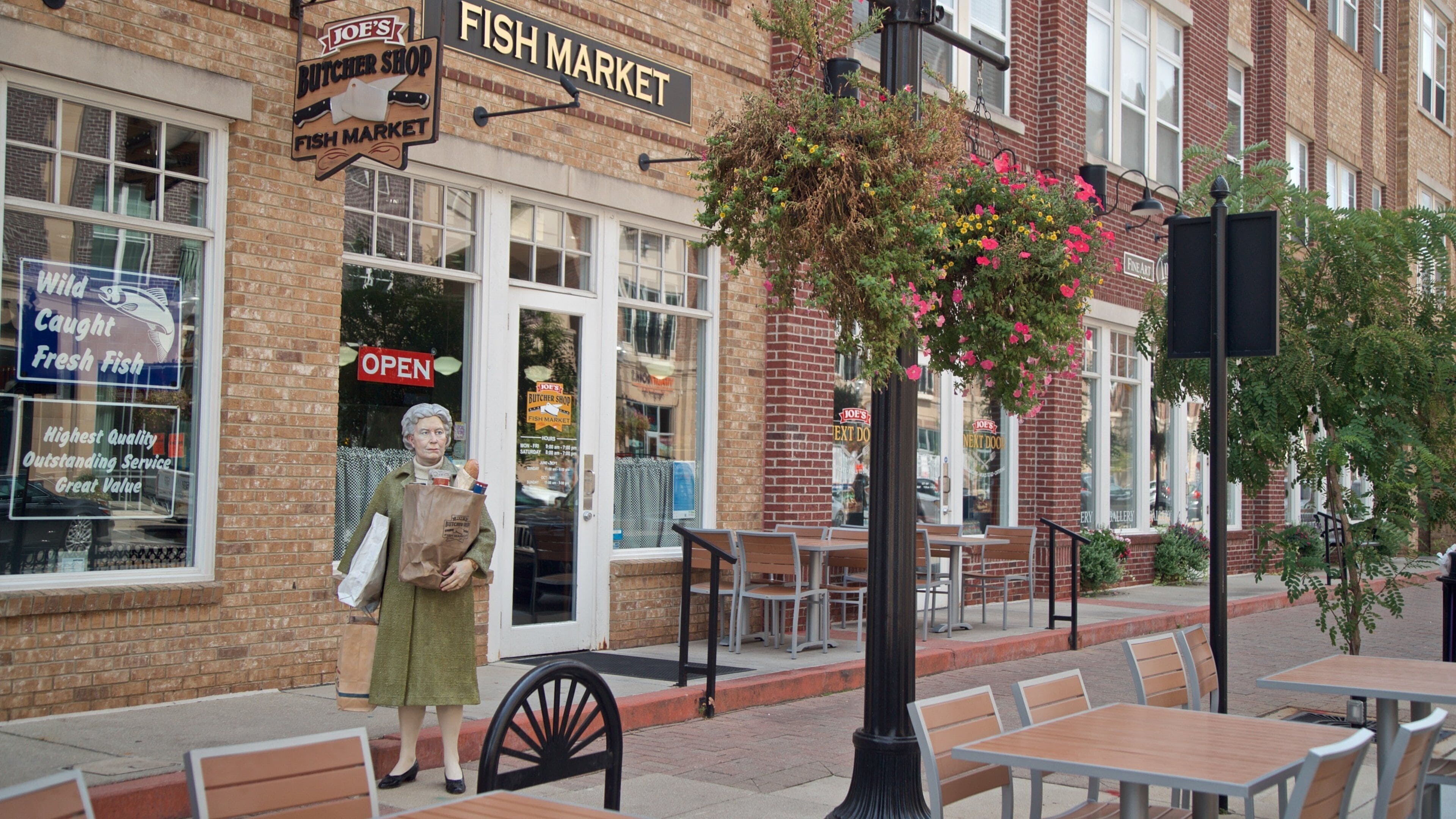 Carmel Arts and Design District which includes outdoor art, a statue or sculpture and flowers
