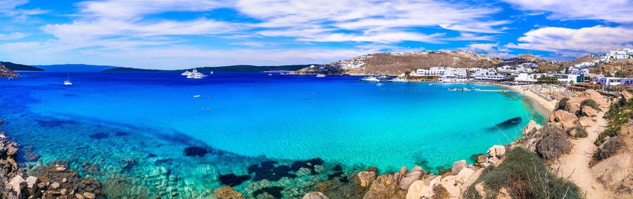 Greece summer holidays. Cyclades .Most famous and beautiful beaches of Mykonos island -Platis Gialos with crystal clear waters