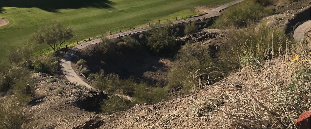 17th hole at the challenging and beautiful Emerald Canyon Golf Course in Parker AZ. 
It's as though they moved mounds of dirt and carved some of the holes/fairways in the valleys. 
You have to drive thru a tunnel under SR 95 to get to holes 4-5-6 then back for 7 and another tunnel for 15-16-17 then back for 18.  
(Feb 2017)