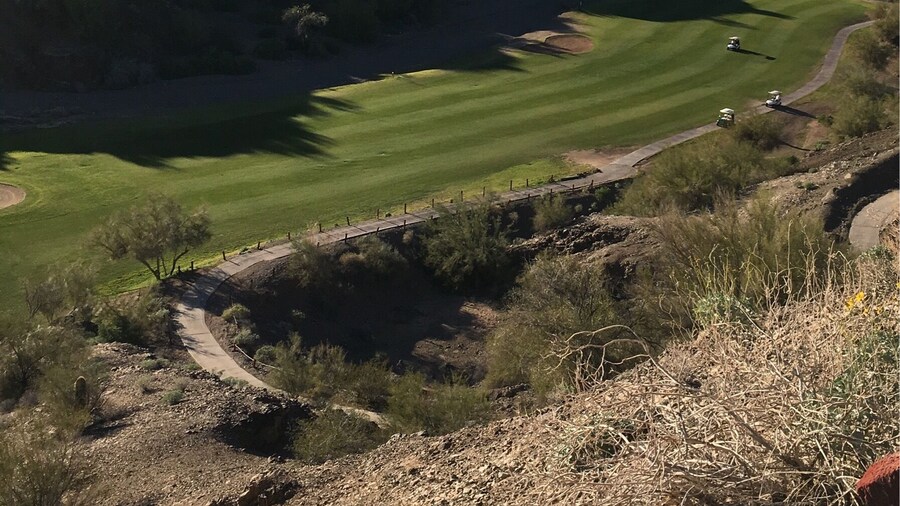 17th hole at the challenging and beautiful Emerald Canyon Golf Course in Parker AZ.
It's as though they moved mounds of dirt and carved some of the holes/fairways in the valleys.
You have to drive thru a tunnel under SR 95 to get to holes 4-5-6 then back for 7 and another tunnel for 15-16-17 then back for 18.