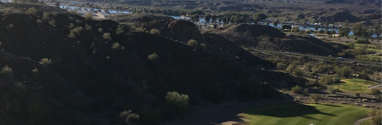 17th hole at the challenging and beautiful Emerald Canyon Golf Course in Parker AZ. 
It's as though they moved mounds of dirt and carved some of the holes/fairways in the valleys. 
You have to drive thru a tunnel under SR 95 to get to holes 4-5-6 then back for 7 and another tunnel for 15-16-17 then back for 18.  
(Feb 2017)