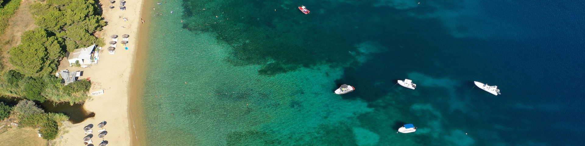 Aerial drone photo of amazing sandy beach of Troulos in island of Skiathos, Sporades, Greece