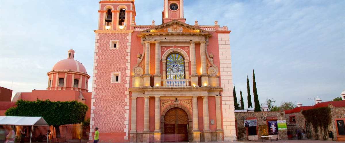 Church of Santa Maria which includes heritage architecture and a square or plaza
