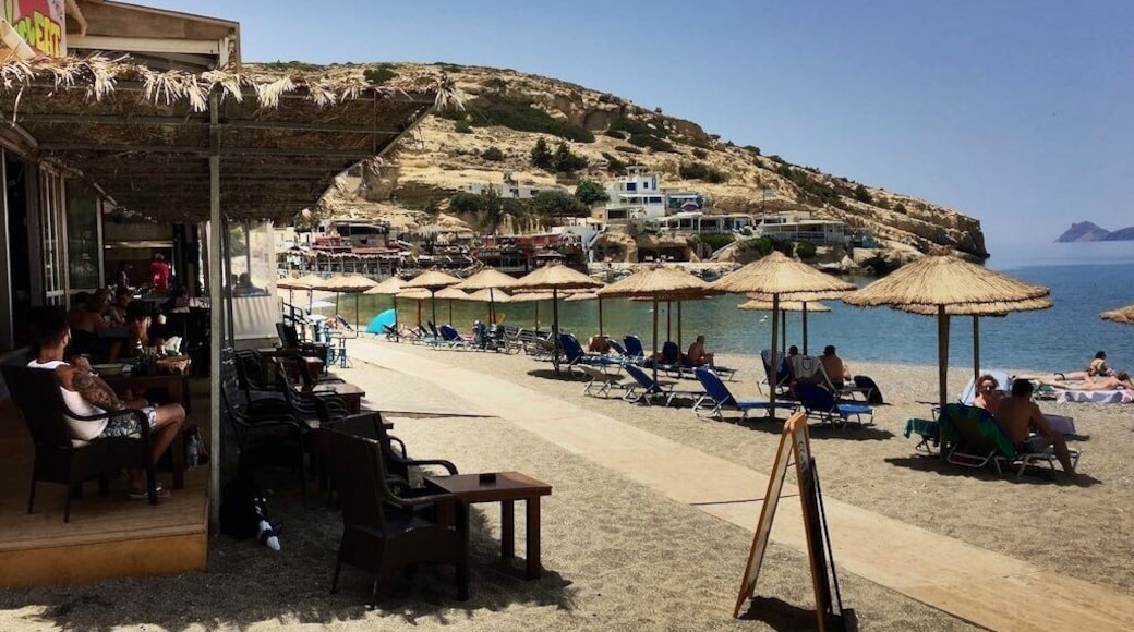 Matala is located 68km southwest of Heraklion, where the plain Messara meets Asteroussia Mountains. This is one of the most popular tourist destinations of Crete and certainly the most famous beach of south Heraklion prefecture. It is famous for the carved caves in the rocks and the hippies of the ‘70s. It is located close to Phaestus, the second largest palace of the Minoan civilization. Matala served as a port of Phaestus, and on the Roman Times, it became a port of Gortyn.