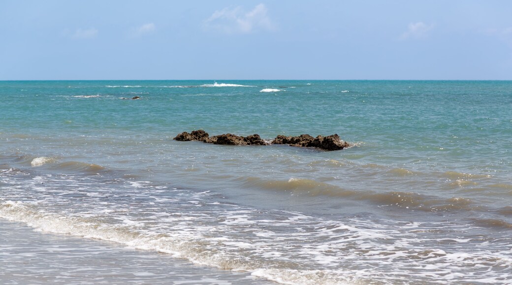 Sand, rocks, and calm waves. Turquoise sea and sparkling waters. Karataş, Adana, Türkiye.