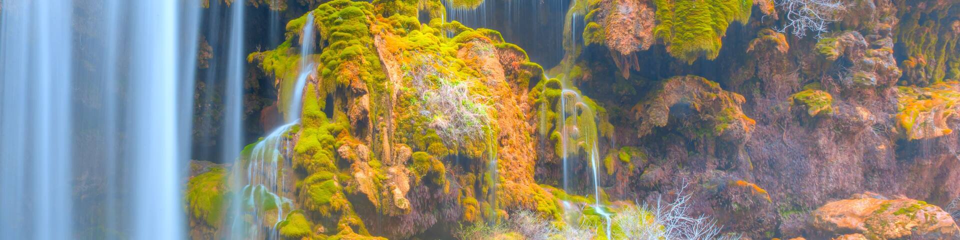 Amazing view of natural Yerkopru waterfall with crystal clear water among green mosses - Mersin, Turkey