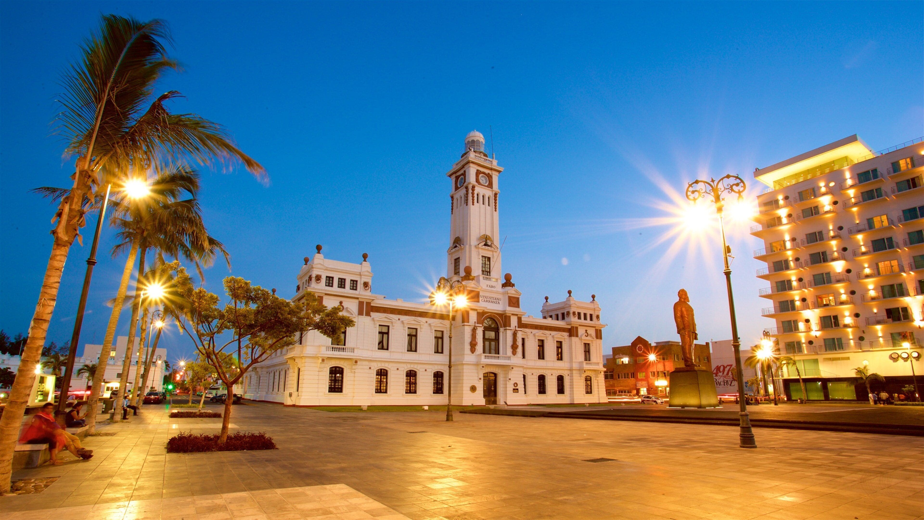 Carranza Lighthouse which includes a statue or sculpture, a square or plaza and night scenes