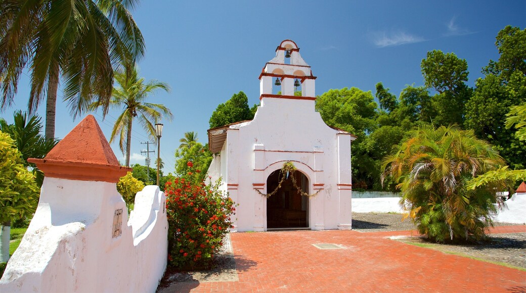 Chapel of the Rosary featuring flowers and a church or cathedral