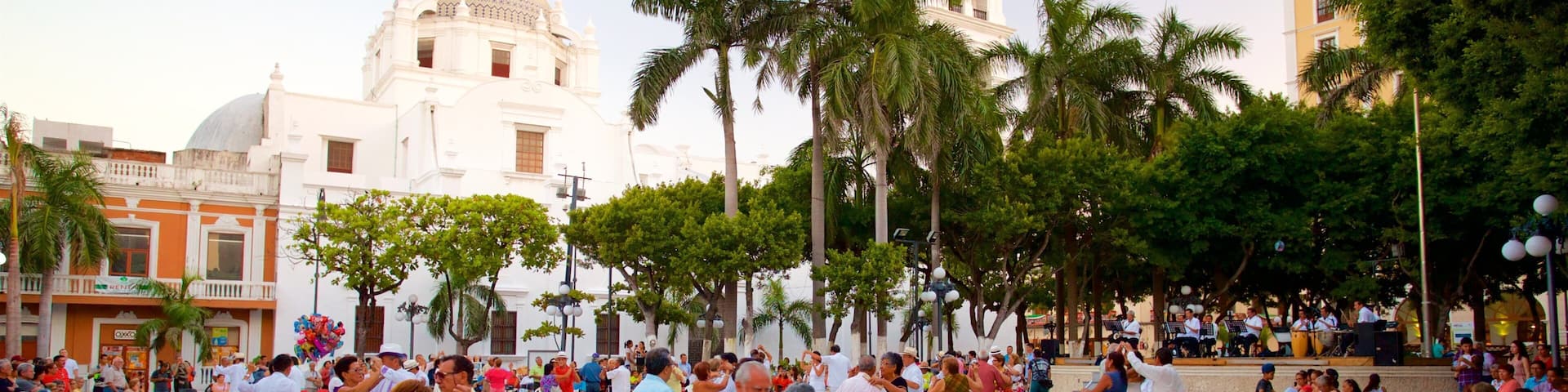 Veracruz Cathedral featuring heritage elements and a square or plaza as well as a small group of people