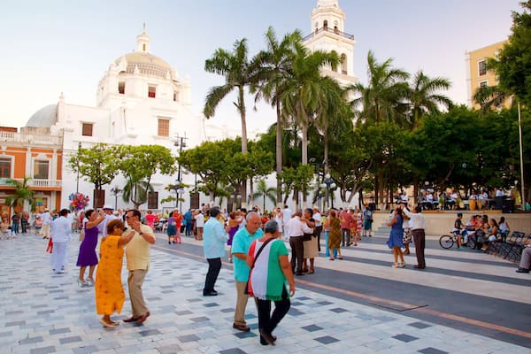 Veracruz Cathedral featuring heritage elements and a square or plaza as well as a small group of people