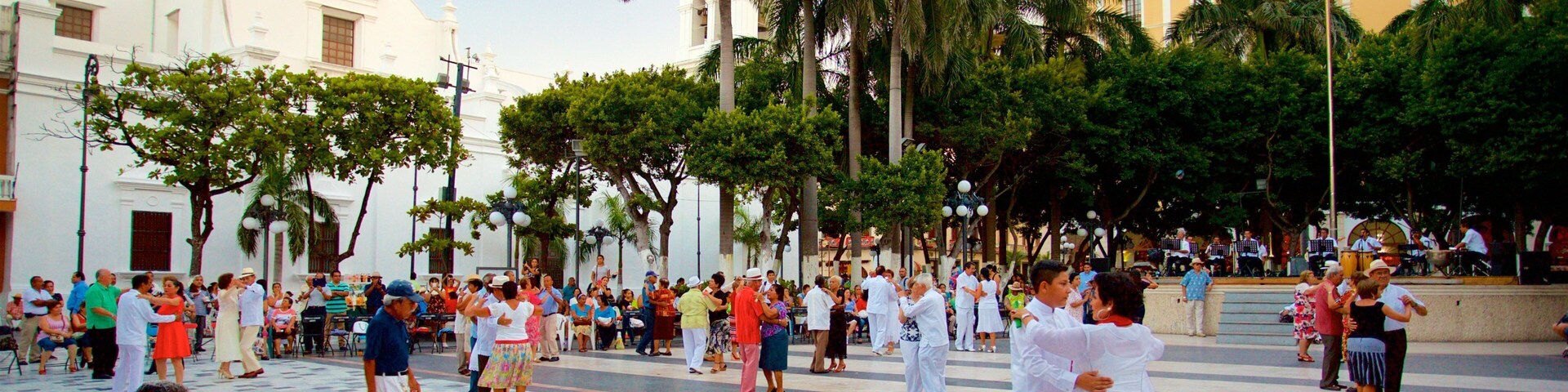 Veracruz Cathedral featuring a square or plaza and heritage elements as well as a small group of people