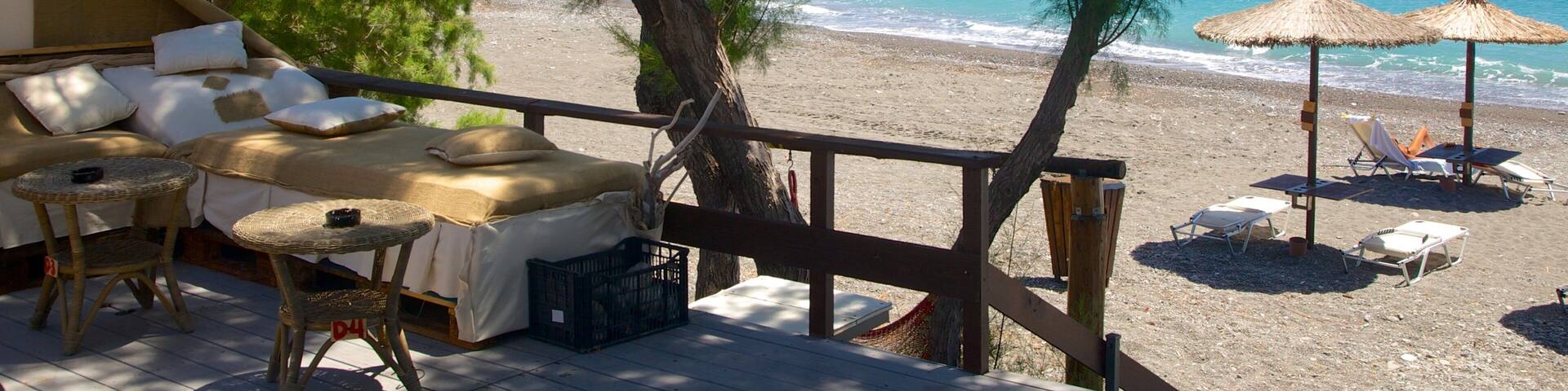 Agios Fokas Beach featuring a pebble beach