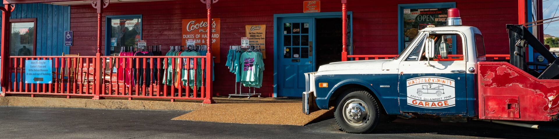 A red storefront with a vintage car and the name "Cooter's" on the sign.