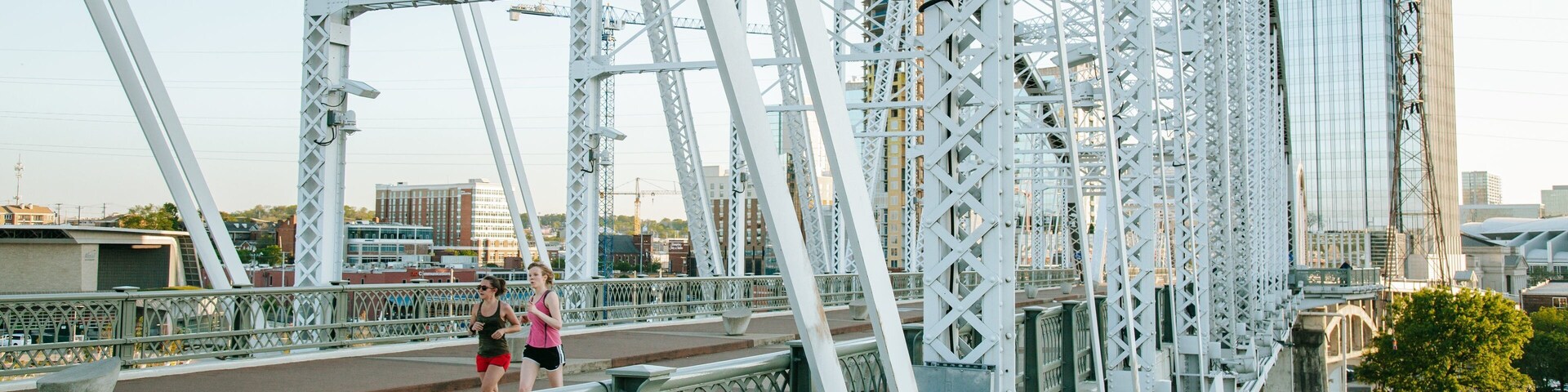 Cumberland Park featuring a bridge and street scenes as well as a couple