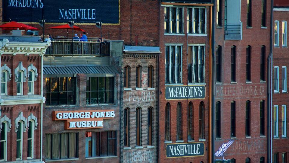 A historic building with signs for McFadden's, George Jones Museum, and Nashville.