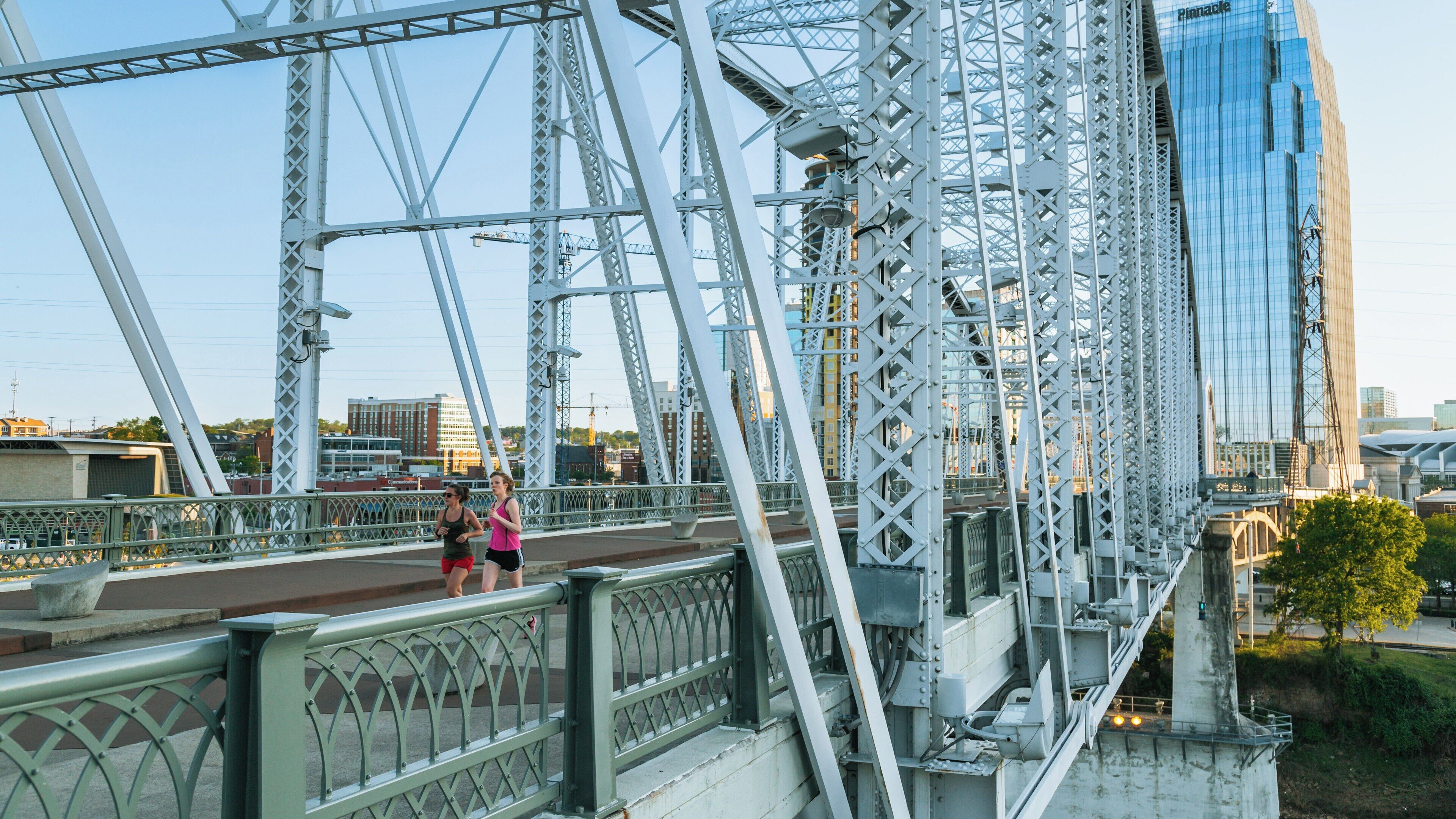 Bright morning run at Cumberland Park in Downtown Nashville, Tennessee with city skyline in the background