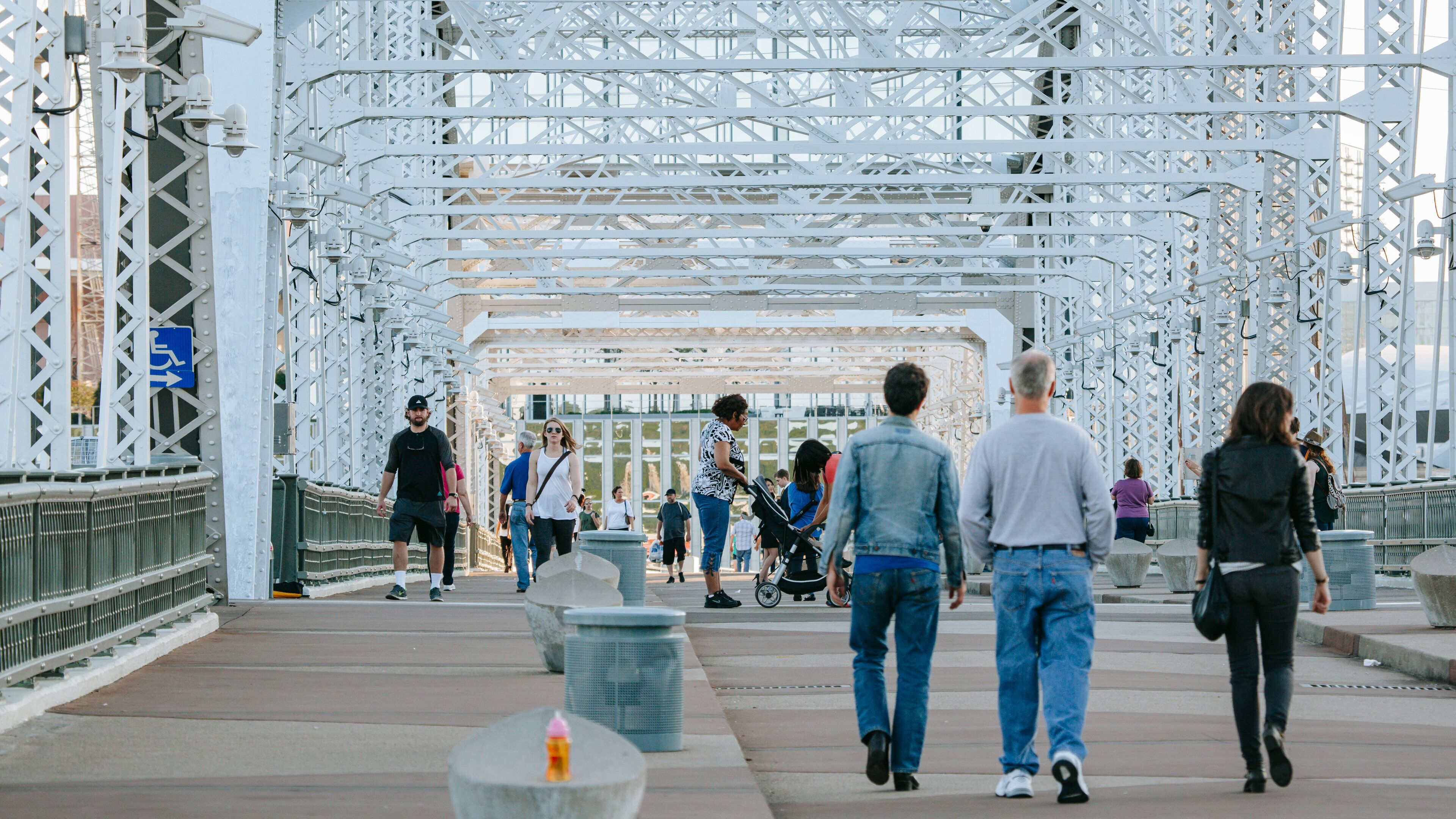 Cumberland Park featuring a bridge as well as a small group of people