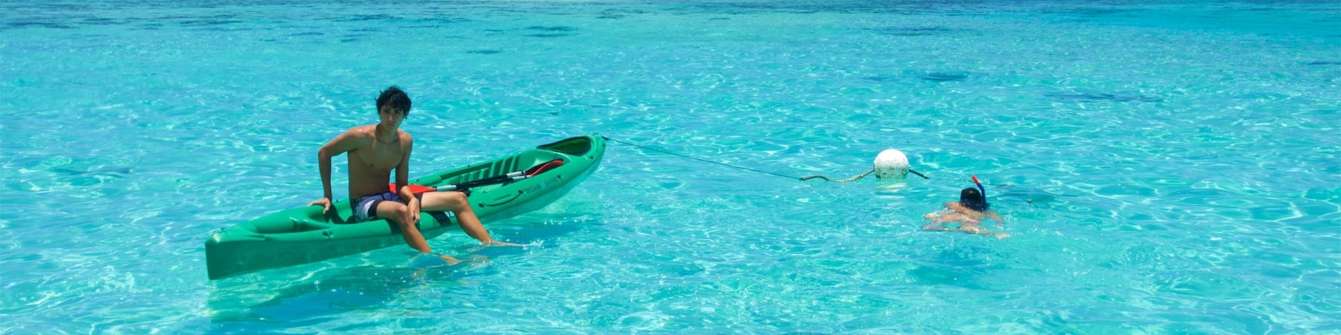 Tiahura Beach featuring snorkelling, general coastal views and kayaking or canoeing