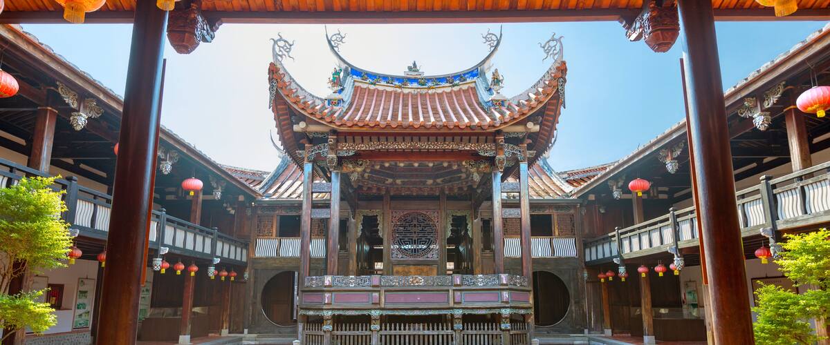 A traditional Chinese pavilion with ornate roof and lanterns.