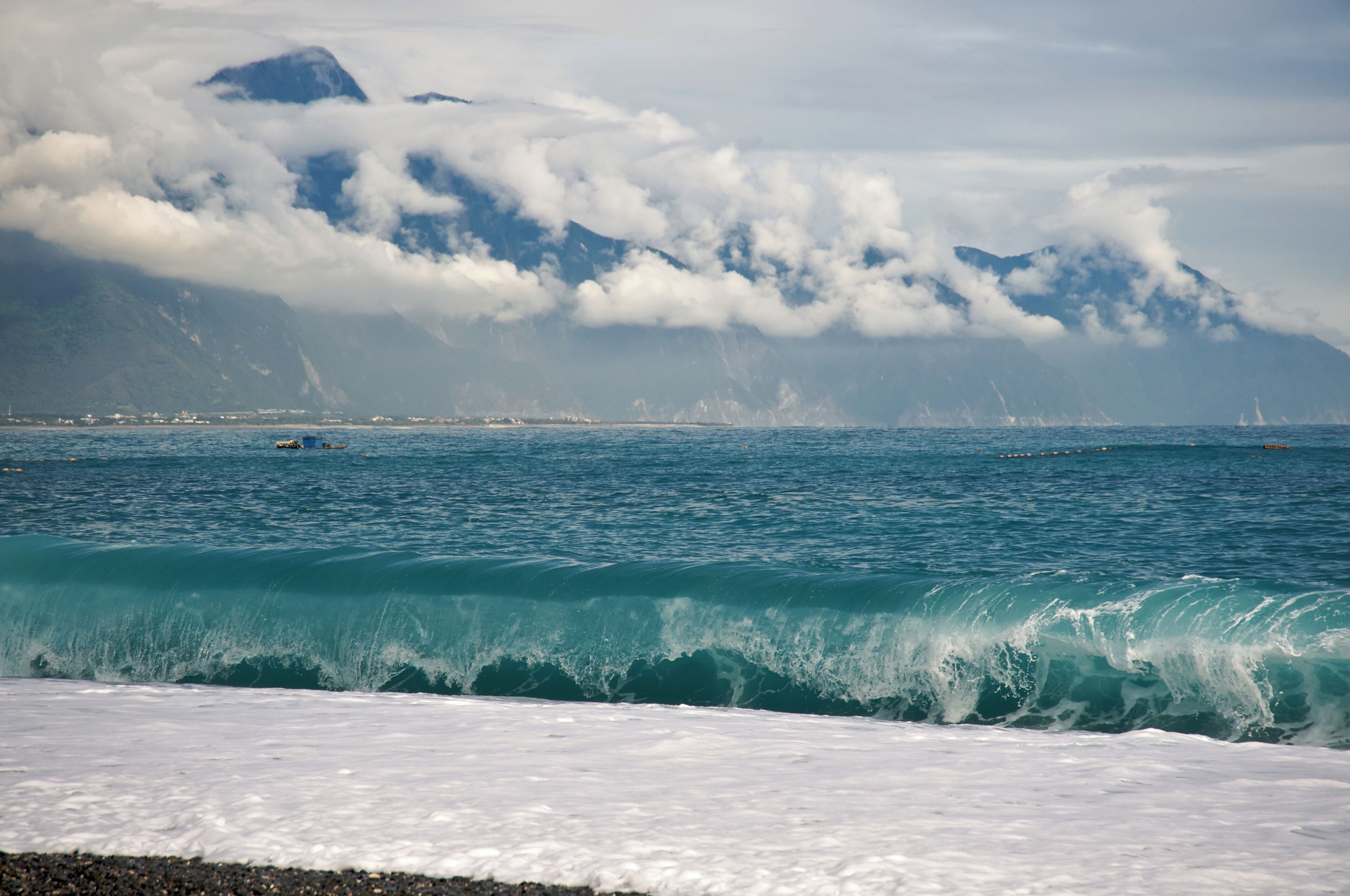 CiSingTan Bay with Fixed-net fishing operations close to shore, and the Central Mountain Range in the background, in Hualien County in Taiwan