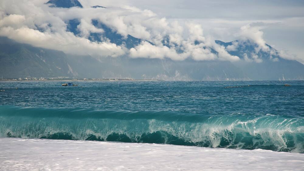 CiSingTan Bay with Fixed-net fishing operations close to shore, and the Central Mountain Range in the background, in Hualien County in Taiwan