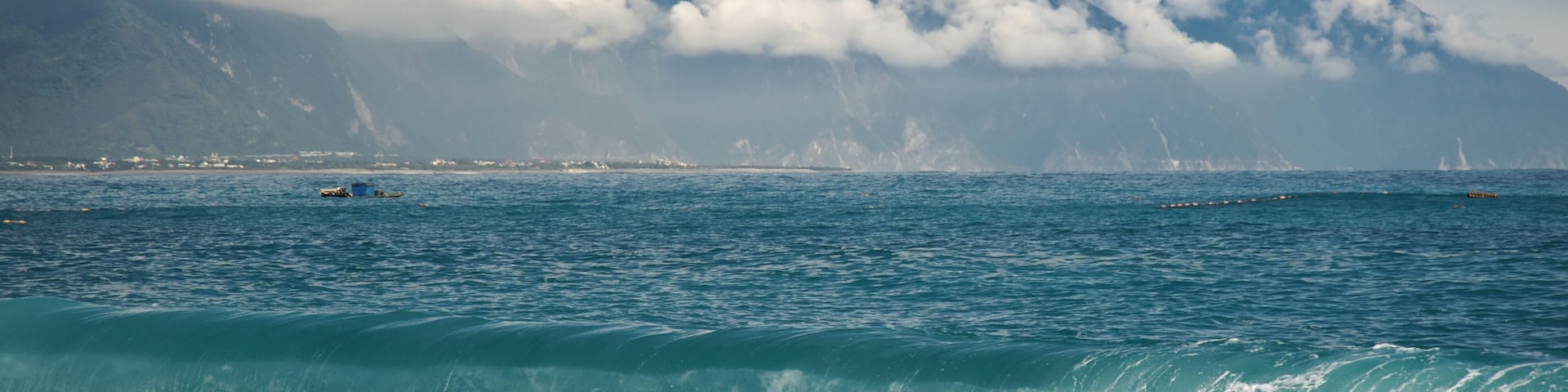 CiSingTan Bay with Fixed-net fishing operations close to shore, and the Central Mountain Range in the background, in Hualien County in Taiwan