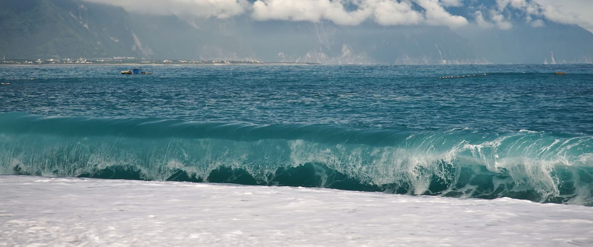 CiSingTan Bay with Fixed-net fishing operations close to shore, and the Central Mountain Range in the background, in Hualien County in Taiwan