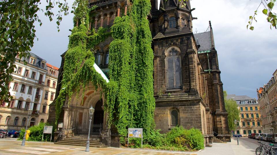 A historic church with ivy-covered walls and a clock tower.