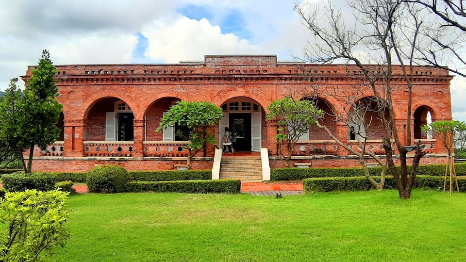 The British Consular Residence at Takow was built on the hill of Shaochuantou. This stand-alone red-brick building with wooden veranda was used as a venue for receiving diplomatic envoys and guests, as well as being the consul's residence. In 1900, it was reconstructed with an arched veranda. During the Japanese colonial period, it was converted into the Kaohsiung Marine Observatory. In the early period after the National Government took over Taiwan, it was converted again as a meteorological observatory. In 1977, Typhoon Thelma devastated the building. In 1985, a restoration project was initiated. In 1987, it was publicly proclaimed a historic site. In 2004, the Bureau of Cultural Affairs repurposed and reutilized this historic site, and it became a famous cultural tourist attraction in Kaohsiung City.