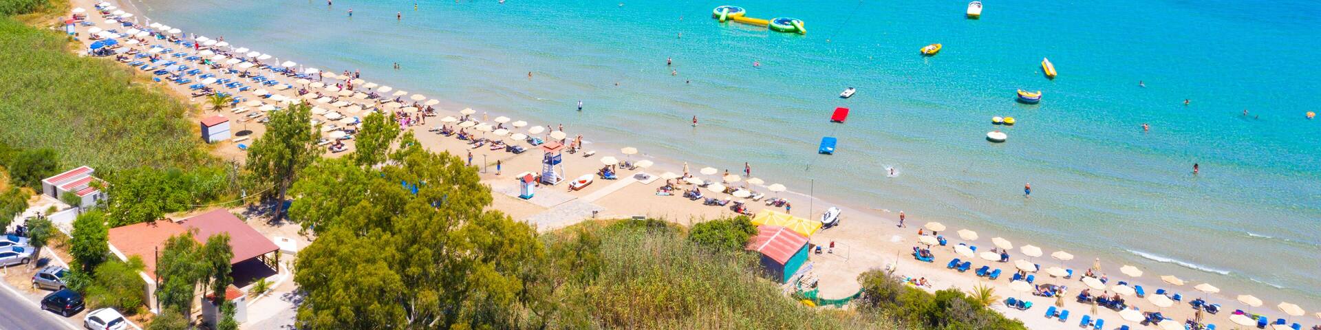 Famous sandy beach of Almyros and the river near Agios Nikolaos, Crete, Greece.