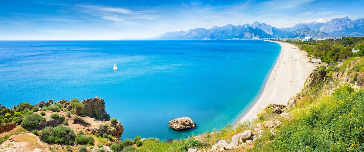 Panoramic aerial view of beautiful blue gulf and long Konyaalti beach in Antalya, Turkey.