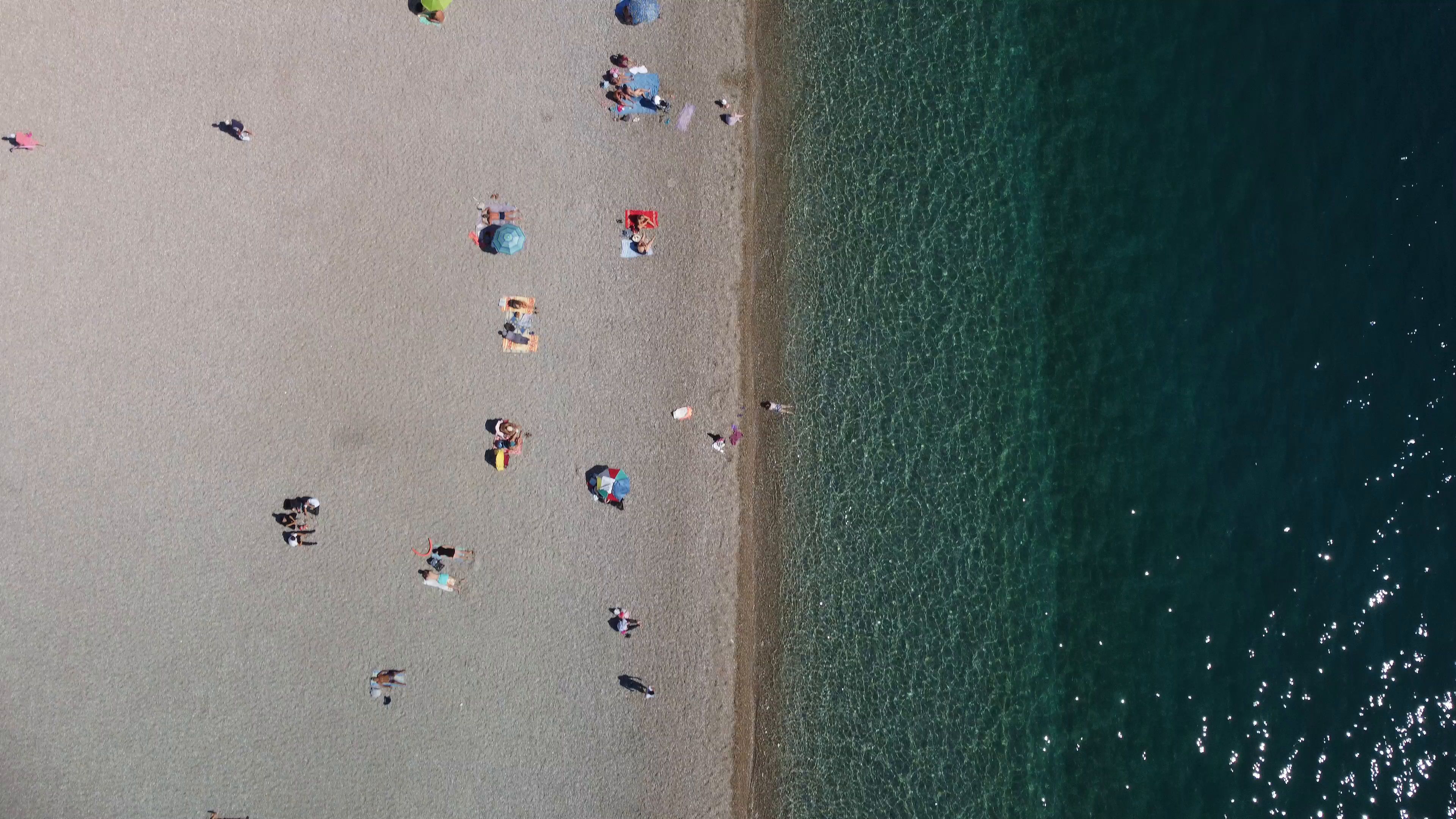 Beachgoers Along the Shore in Antalya