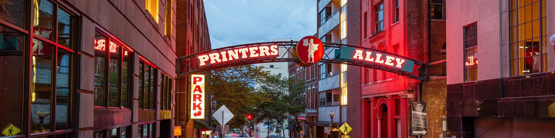 Printer\'s Alley which includes night scenes and signage