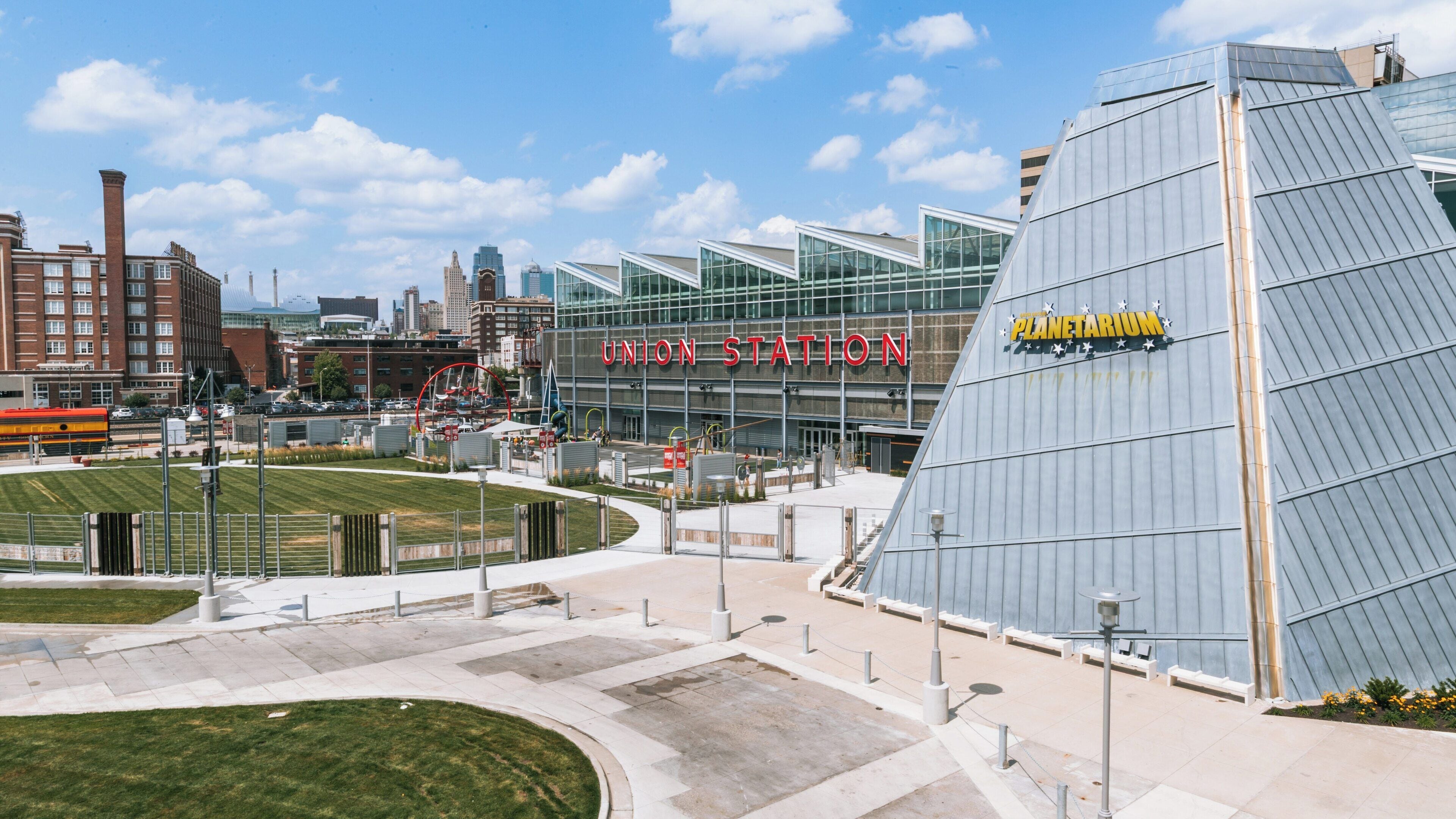 Exploring Science City at Union Station in Downtown Kansas City, Missouri on a sunny day with families enjoying outdoor activities