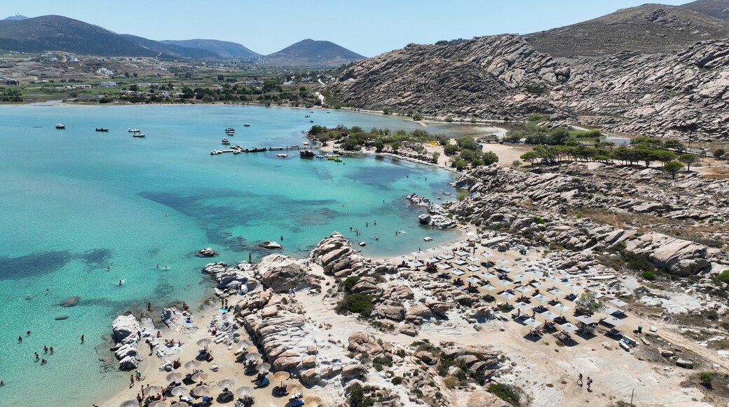Aerial drone photo of famous small organised beach with unique rock formations of Kolimbithres or Kolympithres in the gulf of Naousa, Paros island, Cyclades, Greece