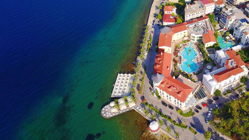 Aerial drone ultra wide photo of famous seaside village well known for thermal springs of Aidipsos, North Evia island, Greece