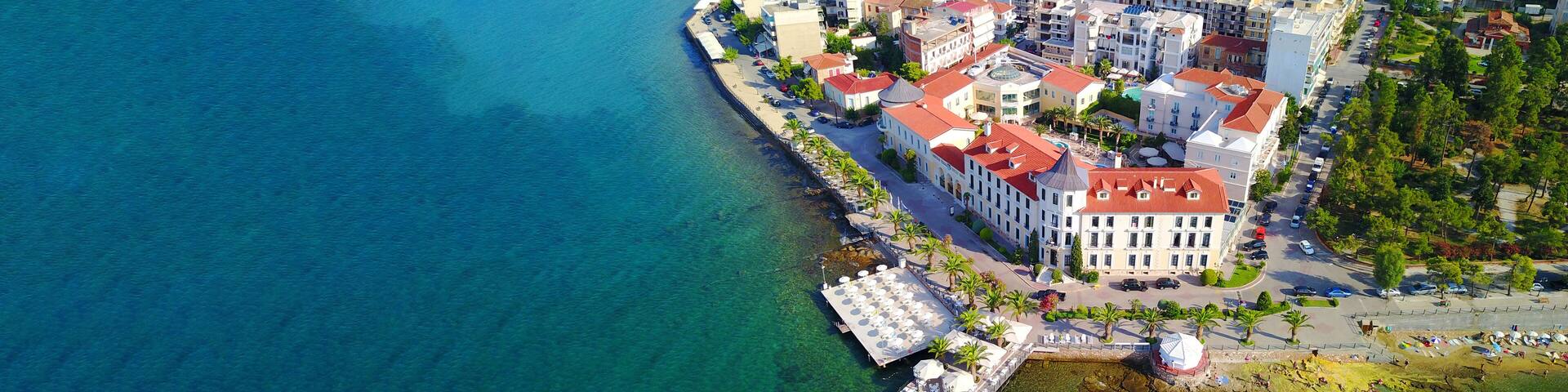 Aerial drone ultra wide photo of famous seaside village well known for thermal springs of Aidipsos, North Evia island, Greece