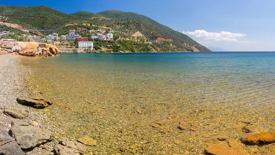 Panoramic view of the beach with a healing spring in the Spa resort of Loutra Edipsou on the Greek island of Evia in Greece