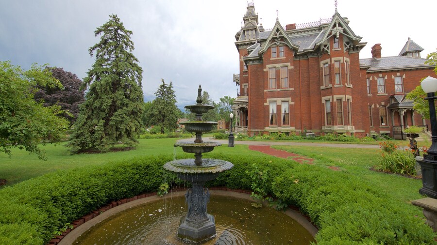 Vaile Mansion featuring a park, a fountain and heritage architecture