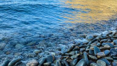 Close-up of pebble beach and sea waves Gokceada; Imbros island, Turkey