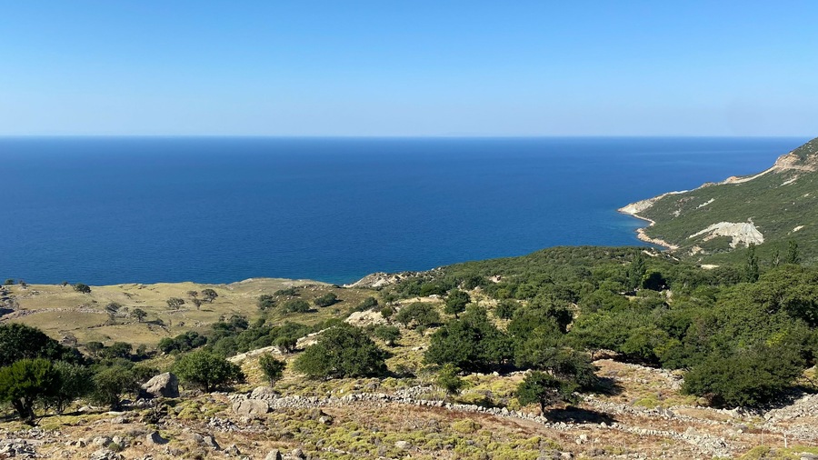 Gokceada (Imbros) coastline seashore view with Samothrace Greek island at background. Tepeköy village, Çınaraltı-Pinarbasi location, Aegean Turkey