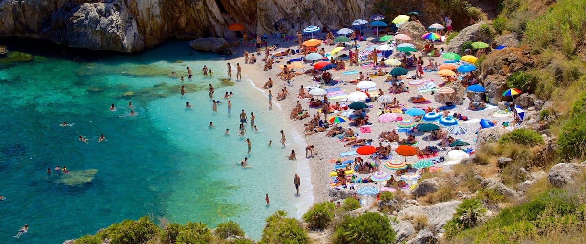 Zingaro Beach which includes a beach, swimming and a bay or harbour